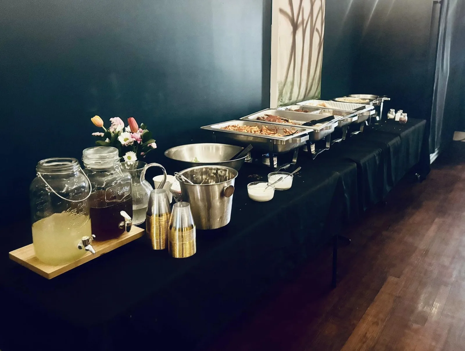 A long banquet table set for a private gathering at Cambria's